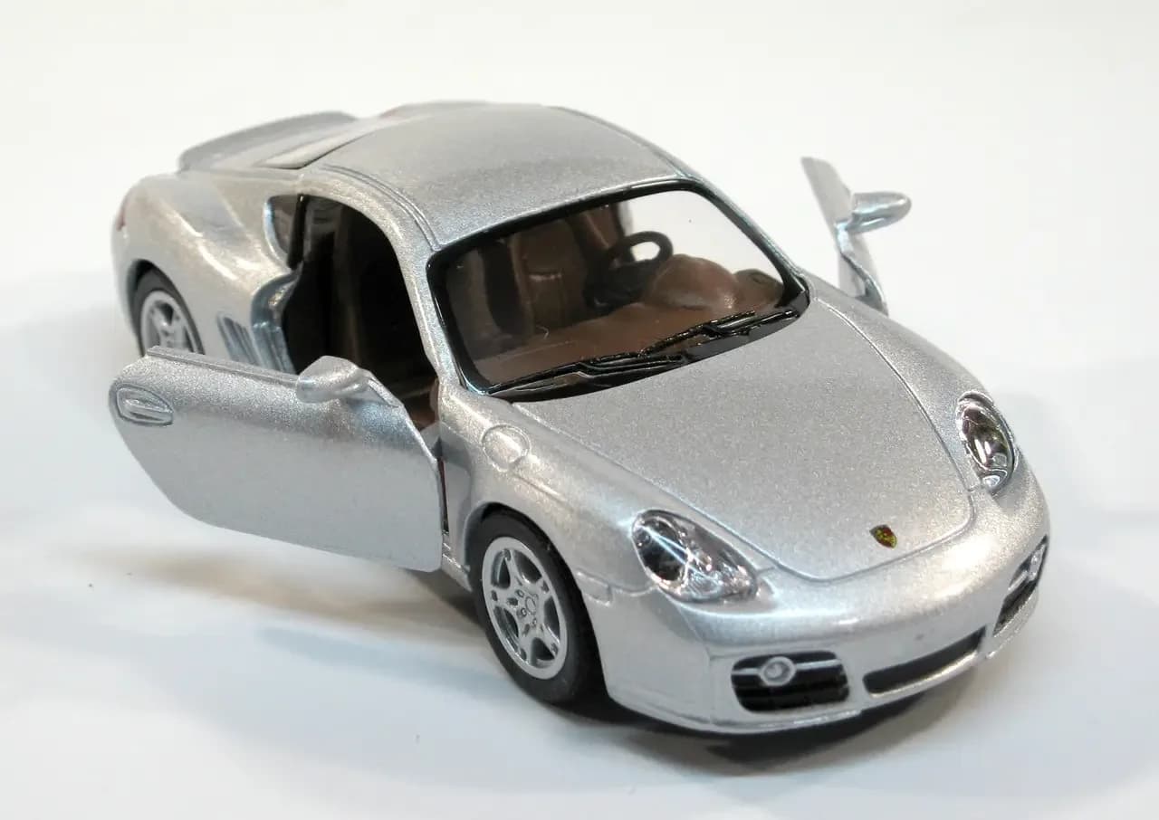 Машина Kinsmart Porsche Cayman S 1:34 KT5307W фото 3 Машина Kinsmart Porsche Cayman S 1:34 KT5307W фото 3