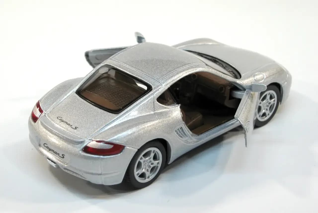 Машина Kinsmart Porsche Cayman S 1:34 KT5307W фото 5 Машина Kinsmart Porsche Cayman S 1:34 KT5307W фото 5